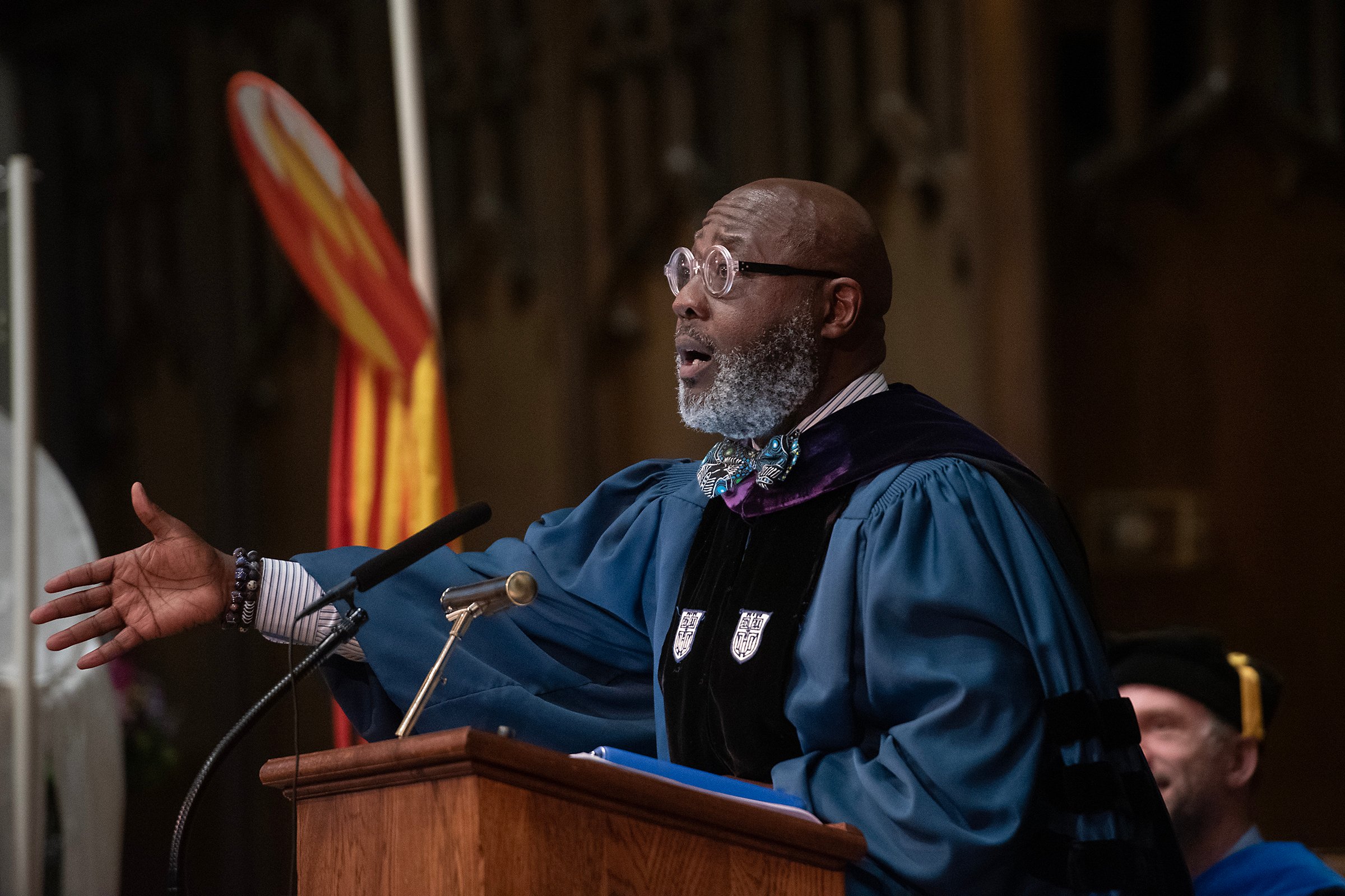 Commencement speaker in cap and gownat lectern